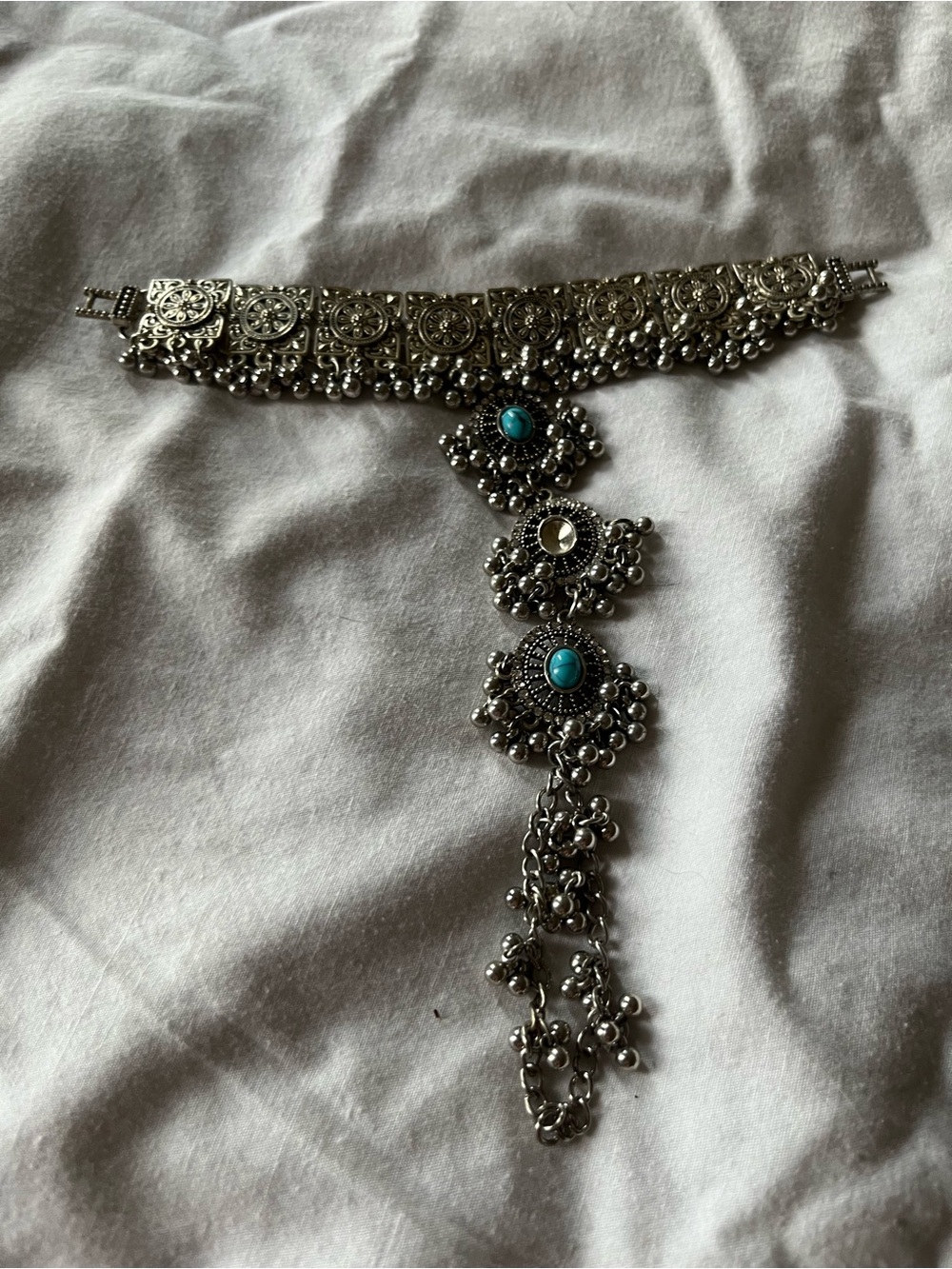 Silver-Tone Boho Drop bracelet w:Turquoise Accents. Once on extends to finger.
